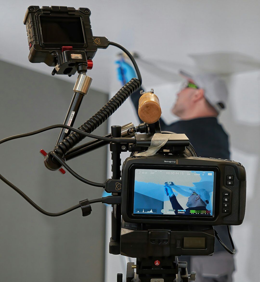 Journalist reviewing an edit timeline on a large monitor