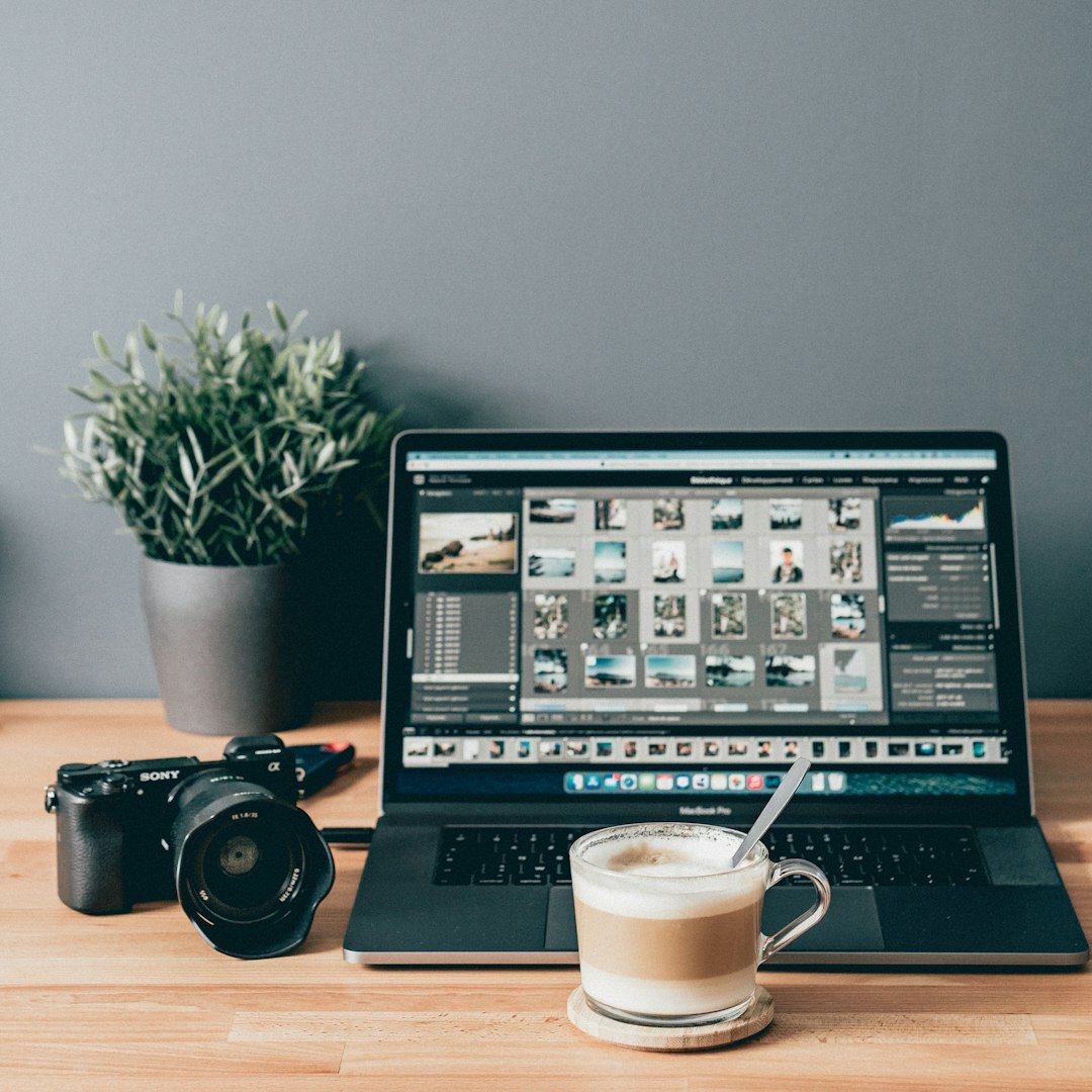 Video editor working on multi camera footage at a laptop